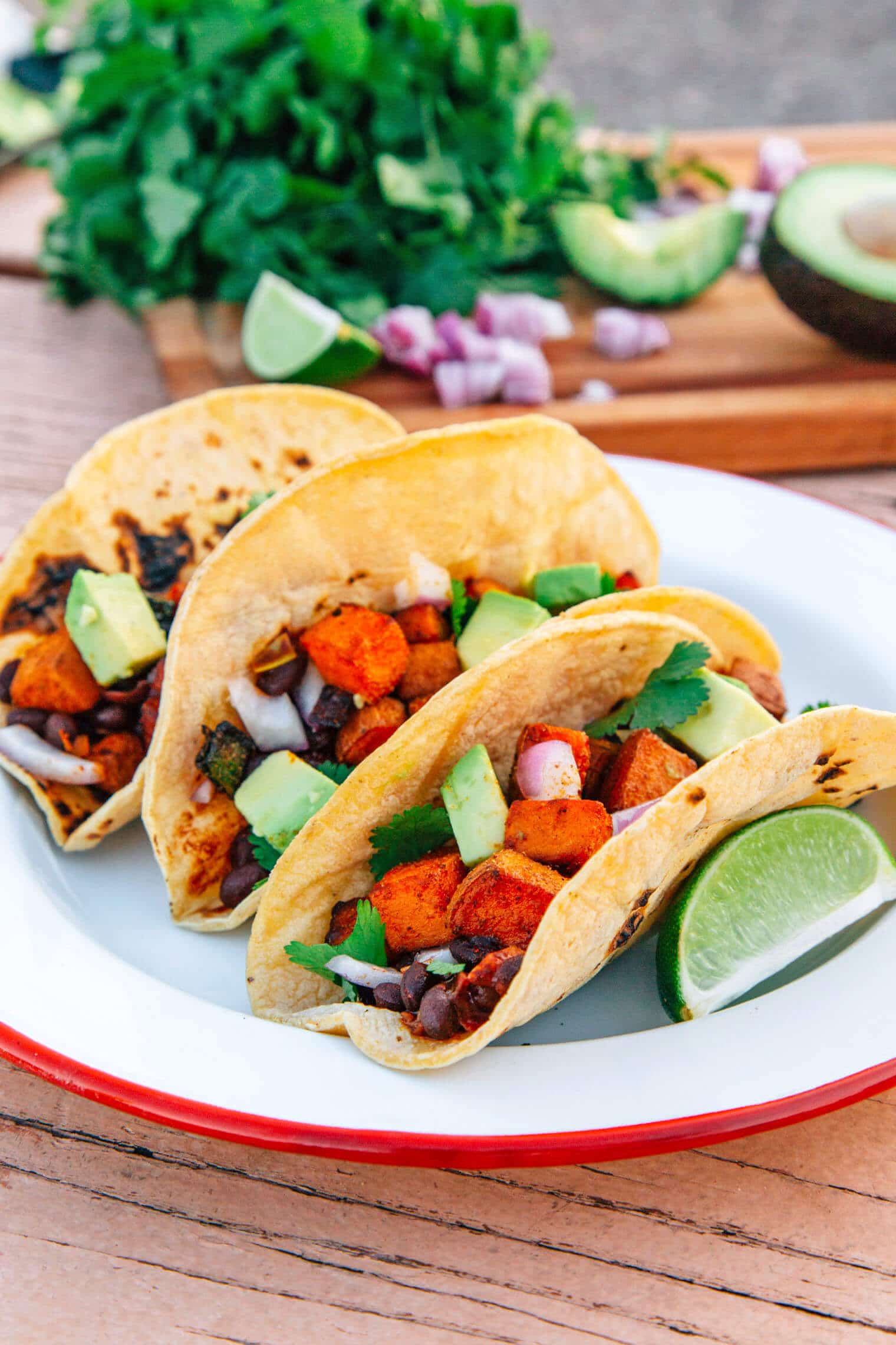 These #vegan Sweet Potato Tacos with smoky black beans are super simple to prepare over the fire on your next camping trip.